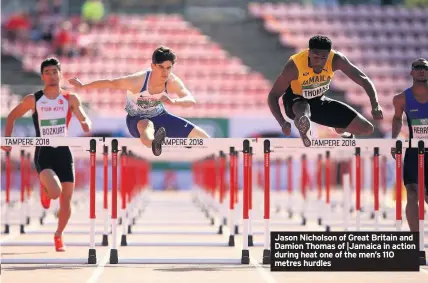  ??  ?? Jason Nicholson of Great Britain and Damion Thomas of |Jamaica in action during heat one of the men’s 110 metres hurdles