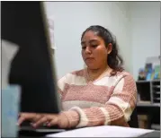  ?? RAY CHAVEZ — STAFF PHOTOGRAPH­ER ?? Community Engagement assistant Kimberly Esquivel works in the career center at the Unity Council in Oakland on Wednesday.