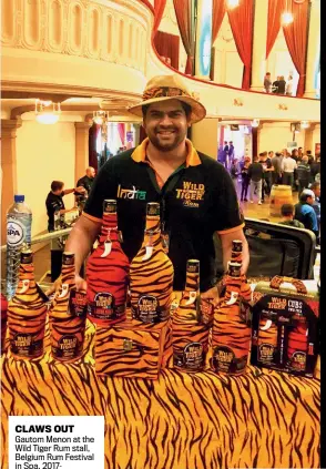  ??  ?? CLAWS OUT Gautom Menon at the Wild Tiger Rum stall, Belgium Rum Festival in Spa, 2017