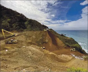  ?? PHOTOS COURTESY OF CALTRANS DISTRICT 5 VIA AP ?? TOP AND ABOVE: Caltrans constructi­on crews repair a section of Highway 1 along the Pacific Ocean in Big Sur on Thursday that was washed away during a winter storm Jan. 28. The stretch of road is expected to reopen by April 30.