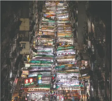  ?? DALE DE LA REY / AFP / Gett y Imag es files ?? A night market in Hong Kong, a city in which Beijing has already opened an office
where its agents will be enforcing the new security law.