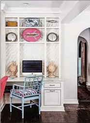  ??  ?? A bookcase area off the kitchen doubles as a home office.