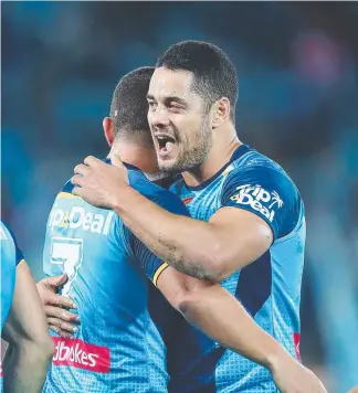  ?? Picture: GETTY IMAGES ?? Jarryd Hayne embraces teammates, thriving on the fun factor at the Titans.