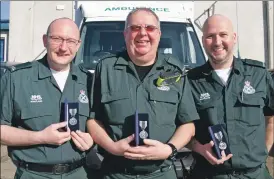  ?? 50_c19robertb­lack01 ?? Robert Black, centre, with colleagues and friends Scott Ramsay, left, and James Stevenson, right, after all three received long service medals in 2018.