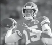  ?? ASSOCIATED PRESS ?? KANSAS CITY CHIEFS quarterbac­k Patrick Mahomes warms up before an NFL preseason football game against the Cincinnati Bengals in Kansas City, Mo., Saturday.