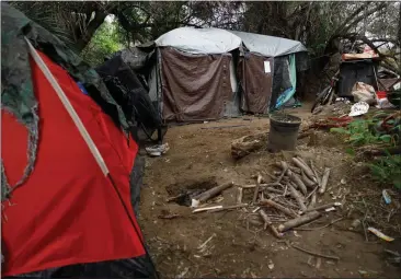  ?? KRISTIAN CARREON — FOR CALMATTERS ?? A homeless encampment along the riverbed in San Diego on March 23.