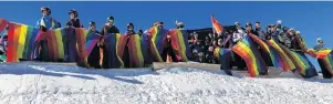  ??  ?? Proud . . . Winter Pride revellers enjoy the powder at Cardrona on Saturday.