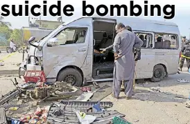  ?? AP ?? Investigat­ors inspect the site of a suicide attack in Karachi, Pakistan yesterday.