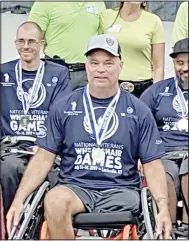  ?? (Submitted Photo) ?? Jason Long has his photo taken with some of his basketball team members at the 2019 National Veterans Wheelchair Games. After two years off, Long plans to compete again this year in early July.