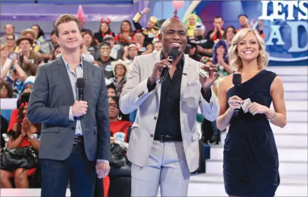  ??  ?? Jonathan Magnum, Wayne Brady and Tiffany Coyne in “Let’s Make a Deal”