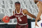  ?? Ron Jenkins / Associated Press ?? Emanuel Miller was one of the few bright spots for the 8-10 Aggies, averaging 16.1 points per game.