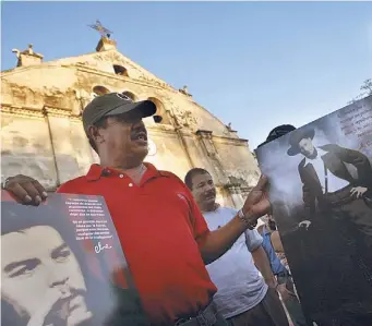  ?? AP ?? Pósters. Guevara y Sandino en las calles de Managua.
