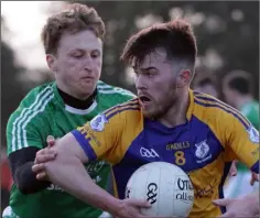  ??  ?? Mick O’Gorman of Taghmon-Camross is tackled by Naomh Eanna defender Pádraig Doyle.