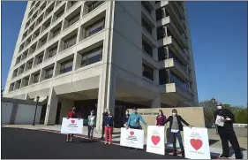  ?? PETE BANNAN - MEDIANEWS GROUP ?? Delaware County Council members Dr. Monica Taylor, council vice chairman, Elaine Paul Schaefer and Christine Reuther carried signs of support for staff and residents at Fair Acres Geriatric Center in Middletown Wednesday evening.