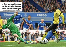  ?? Michael Regan/Getty Images ?? Everton goalkeeper Jordan Pickford saves from Antonio Rudiger