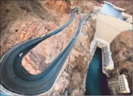  ?? Brian van der Brug Los Angeles Times
Mary Forgione ?? THE HOOVER DAM BYPASS, whose official name is the Mike O’callaghan-pat Tillman Memorial Bridge, looms 890 feet above the Colorado River and includes spots to stop and snap panoramic photograph­s of the canyon and historic dam.