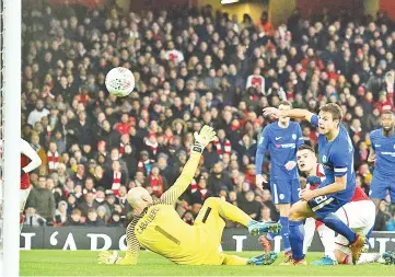  ??  ?? Arsenal’s English midfielder Jack Wilshere (R) scores the team’s second goal during the League Cup semi-final football match between Arsenal and Chelsea at the Emirates Stadium in London. - AFP photo