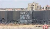  ?? PICTURE: MAANIMAGES ?? Graffiti calling for the ‘boycott of Israeli blood diamonds’ on the separation wall between Israel and the West Bank.