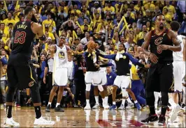  ?? GETTY IMAGES ?? Cavs star LeBron James turns to J.R. Smith as if to wonder what he was thinking when he tried to dribble out the clock with seconds left in a tie game Thursday.