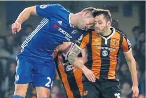  ?? Picture: CATHERINE IVILL/GETTY ?? Clash of heads: Gary Cahill, left, and Ryan Mason collide at Stamford Bridge