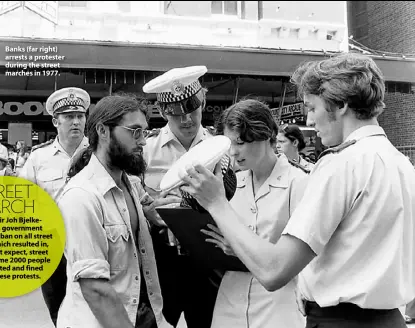  ??  ?? Banks (far right) arrests a protester during the street marches in 1977.