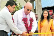  ??  ?? Ruwan Waidyaratn­e, Managing Director of Hayleys Advantis Limited (left) and Mohan Pandithage, Chairman and Chief Executive of Hayleys PLC cut the ribbon at the ceremonial opening of Logistics Internatio­nal’s inland container depot in Sedawatte, Colombo