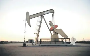  ??  ?? A pump jack operates at a well site leased by Devon Energy Production Company near Guthrie, Oklahoma. — Reuters photo