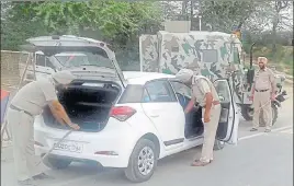  ??  ?? Police personnel checking a vehicle ahead of the Independen­ce Day near AttariBord­er in Amritsar on Saturday. HT PHOTO