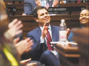  ?? Brian A. Pounds / Hearst Connecticu­t Media ?? DECD Commission­er David Lehman applauds during Gov. Ned Lamont’s budget address to the General Assembly at the Capitol in Hartford on Feb. 20.