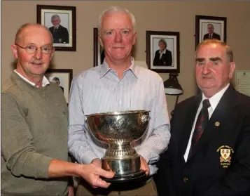  ??  ?? Eamonn O’Connor (sponsor) and Paddy Cleary (Wexford Captain) present the Studio Cup to Tom Foran.