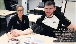  ??  ?? Ryan Ince of Widnes Vikings has his blood pressure checked by Alisha Graves, Halton’s health check officer