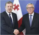  ??  ?? BRUSSELS: Georgia’s Prime Minister Giorgi Kvirikashv­ili (left) is welcomed by European Commission President Jean-Claude Juncker at the European Commission in Brussels. — AFP