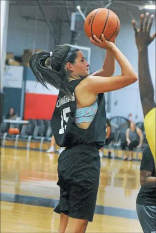  ?? GENE WALSH — DIGITAL FIRST MEDIA ?? Caitlyn Cunningham, a Mount St. Joe’s graduate, pulls up to shoot at women’s NCAA summer basketball league.