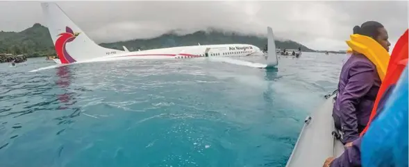  ?? Photo: Radio New Zealand ?? The Air Niugini 737-800 plane after it crashed into the sea short of the runway in Chuuk, Federated States of Micronesia.