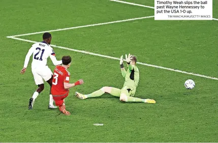  ?? TIM NWACHUKWU/GETTY IMAGES ?? Timothy Weah slips the ball past Wayne Hennessey to put the USA 1-0 up.