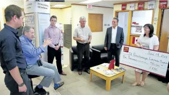  ?? CLIFFORD SKARSTEDT/EXAMINER ?? Junior Achievemen­t Peterborou­gh Lakeland Muskoka president and CEO John McNutt, second from left, next to, from left, Junior Achievemen­t Company Program co-ordinator Simon Treviranus, chairman Paul Ayotte, middle, manager Mike Baxter of commercial...