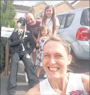  ??  ?? Anne Newbery with her family – husband Paul and daughters Beth (10) and Pollyanna (5) – alongside the Invisible Man