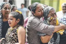  ?? HARROWING TIMES: Relatives and friends attend a funeral for a victim of the earthquake in Juchitan. Picture: AFP ??