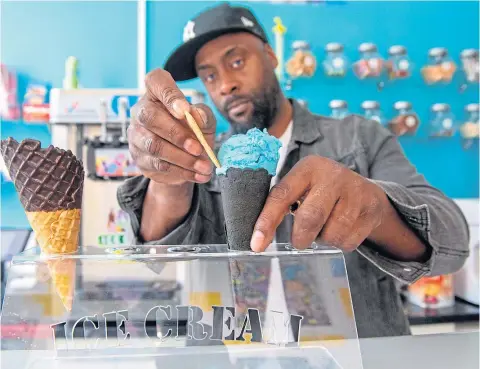  ?? ?? CONE KING: Anthony Shillingfo­rd serves up a tasty creation at Reddy’s, below, a chocolate feast and cookies by Cookie Cult. Photograph­s by Kath Flannery.