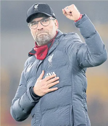  ??  ?? Liverpool manager Juergen Klopp reacts after his team beat Wolves on Thursday.