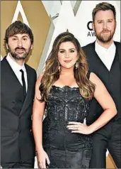  ?? EVAN AGOSTINI/INVISION ?? Dave Haywood, from left, Hillary Scott and Charles Kelley are changing their country group’s name to Lady A.