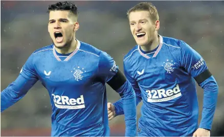  ??  ?? All smiles:
Steven Davis (right) with Rangers team-mate Ianis Hagi