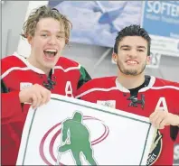  ?? JASON SIMMONDS/TC MEDIA ?? Kensington Monaghan Farms Wild forward Zach Thususka, left, and teammate Evan Gallant hold the provincial major midget hockey championsh­ip banner after defeating the Charlottet­own Bulk Carriers Pride 6-1 in Game 7 of the best-of-seven series on...