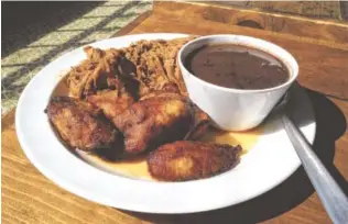  ?? STAFF PHOTOS BY CHRIS ZELK ?? Embargo 62’s Ropa Vieja entree with black beans and sweet plantains.