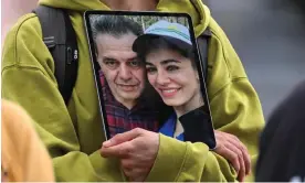  ?? ?? A photo of Jamshid Sharmahd, left, an Iranian-German who is a permanent US resident, is held by a demonstrat­or during a protest in Berlin last month. Photograph: Ina Fassbender/ AFP/Getty