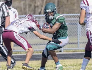  ?? James Franco / Special to the Times Union ?? Schalmont senior Darius Green tries to get by Lansingbur­gh junior Jevon Beckett on Saturday. Green caught six passes for 132 yards and had three TD catches.