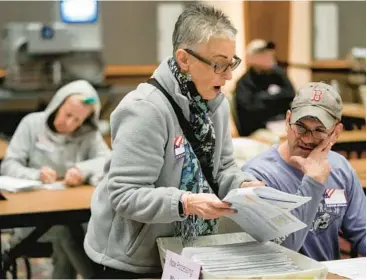  ?? MORRY GASH/AP 2022 ?? Workers count absentee ballots Nov. 8 in the midterm election at the Wisconsin Center in Milwaukee.