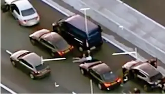  ??  ?? Drama: Helicopter footage shows the van surrounded by unmarked police cars