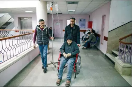  ?? WISSAM NASSAR/THE NEW YORK TIMES ?? A Palestinia­n cancer patient at a hospital in Gaza City, on February 8. United Nations officials warn that Gaza is nearing total collapse, with medical supplies dwindling.