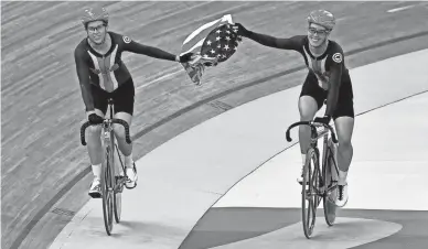  ?? LUIS ACOSTA/AFP VIA GETTY IMAGES ?? Christina Birch, right, of Gilbert and Kimberly Geist after winning the Madison track cycling race at the 2019 Pan American Games in Lima, Peru.